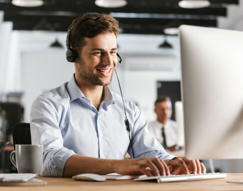photo-businesslike-man-20s-wearing-office-clothes-headset-working-computer-call-center
